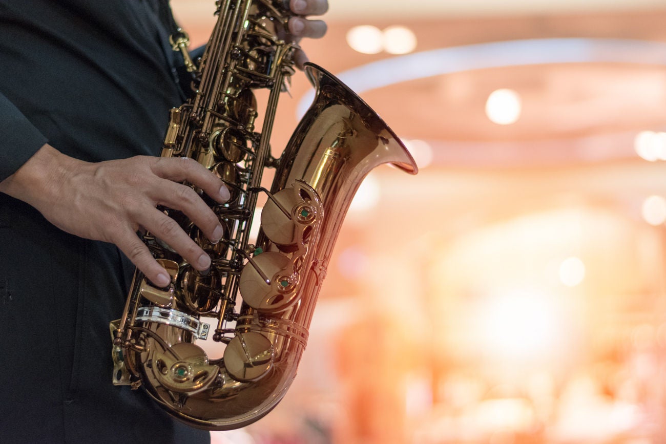 International jazz day and World Jazz festival. Saxophone, music instrument played by saxophonist player musician in fest.